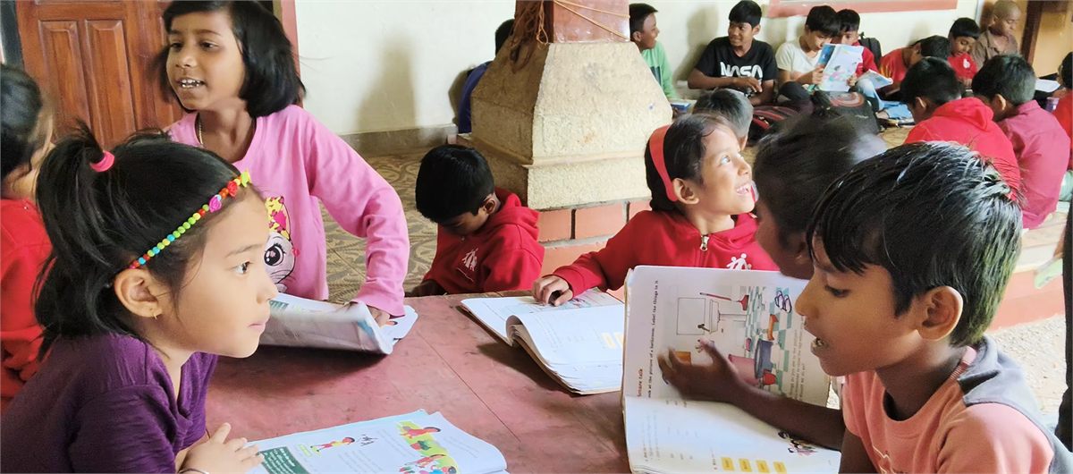 Children reading together at the Bengaluru open education centre